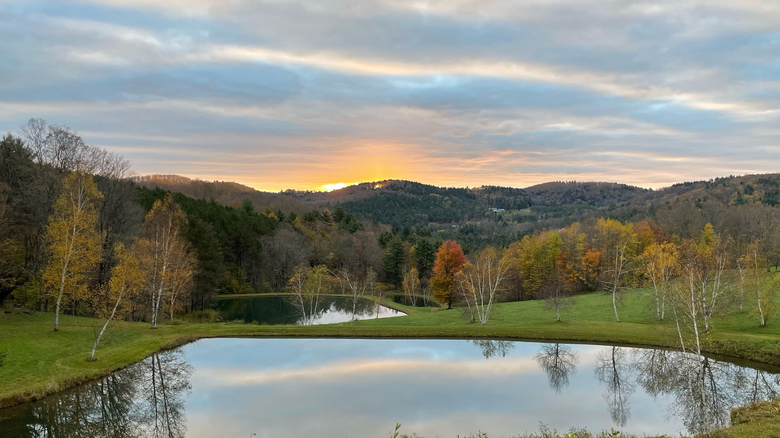 Wild Wonder Farm landscape — valley view with ponds at sunrise